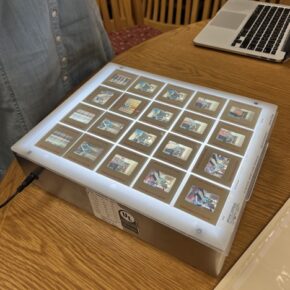 Sheet of color negatives on a lightbox, from one of Rollie McKennas photoshoots.