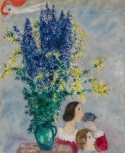 Painting of blue and yellow flowers in a vase with a couple looking out of frame at bottom right and a nude figure at upper left.