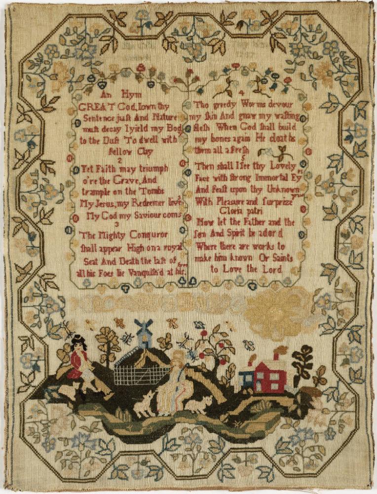 Embroidered sampler with verse in the middle and a country scene at bottom